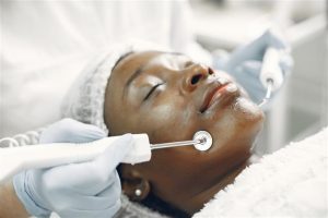 Woman demonstrating the right order of facial care routine with cleanser and cream products